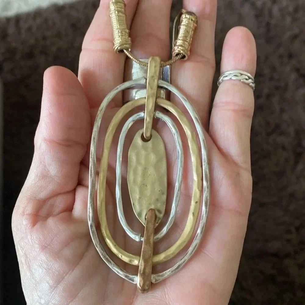 Statement gold and silver tone pendant necklace